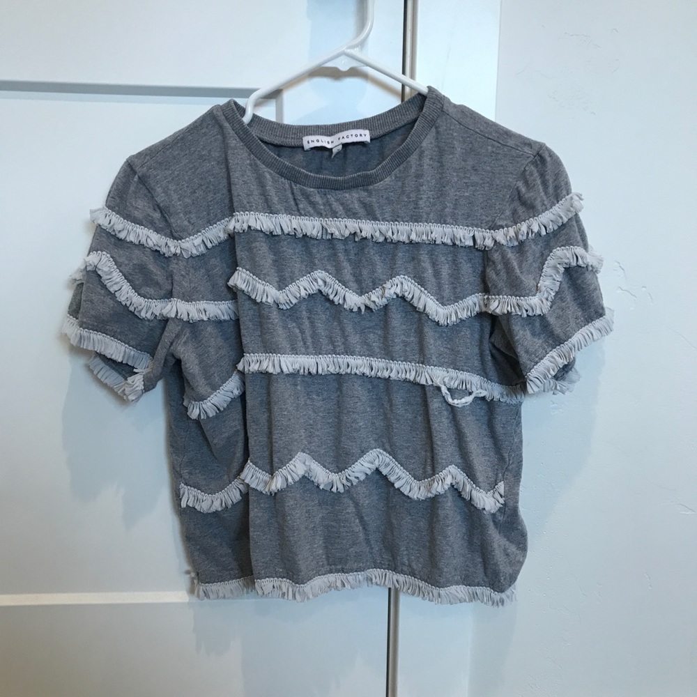 gray tee with white fringe